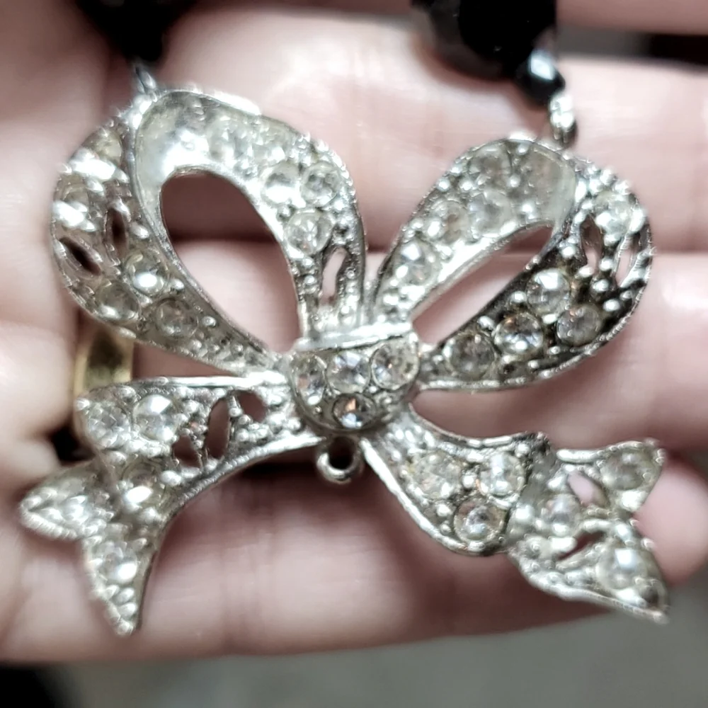 Boutique black, silver tone with a bling bow necklace